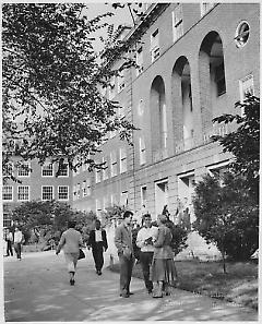 [Students walking and conversing in front of Boylan Hall]