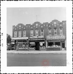 [Northeast corner of 86th Street and 17th Avenue (at far left).]