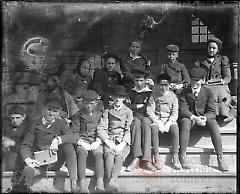 [Two women and some children on steps]