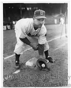 [Francis Brown posing with ball and glove]