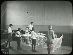 [Boys with nets during instruction]