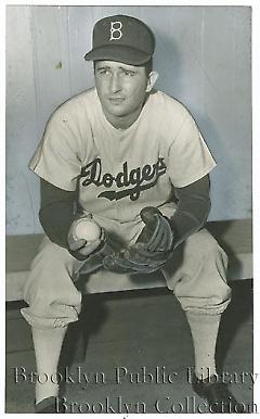 [Erv Palica seated in dugout]