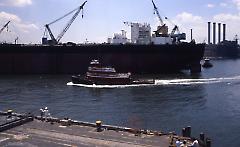 [T.T. Stuyvesant leaving with a tugboat nearby]