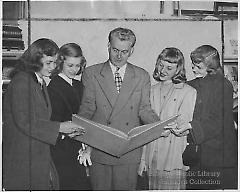 [Four Fort Hamilton High School seniors with James J. Kelly]