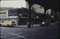 [Woman standing at an intersection]