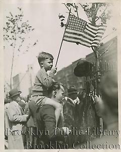 [Boy on father's shoulders]