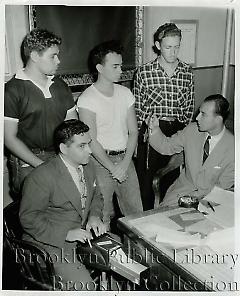 [Three adolescent boys with assistant district attorney and stenographer]