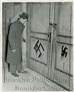 [Swastikas on doors of synagogue]