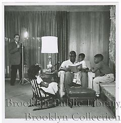 [Jackie Robinson reading to his children]
