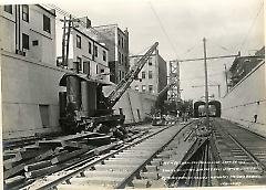 Looking west from 300 feet east of 18th Ave. showing retaining walls, arches, machinery and roadbed