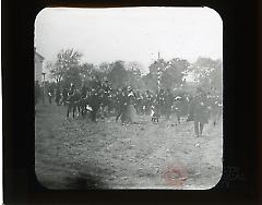 [Crowd of people outside at auction]