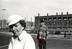 [Man and woman near abandoned building]