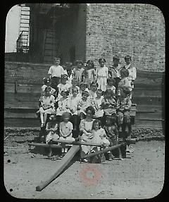 [Group portrait on carriage]