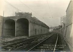 Looking west at 21st Ave. showing arches of 20th Ave. bridge
