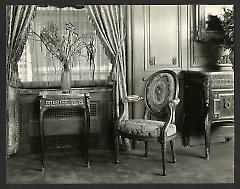 Weil-Worgelt apartment; chair and end table with vase in French eighteenth-century revival style.