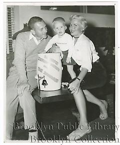[Clem Labine with wife and son]