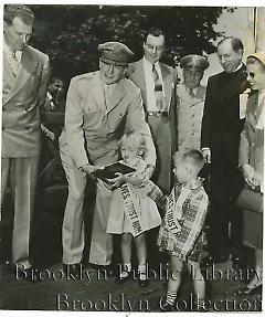 [Douglas MacArthur with boy and girl]