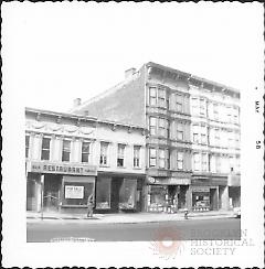 [At left is a vacant bar & grille restaurant for sale.]