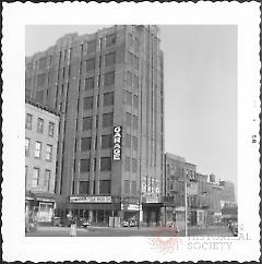 [The large building with the garage is on the north corner of Orange Street and Fulton Street.]