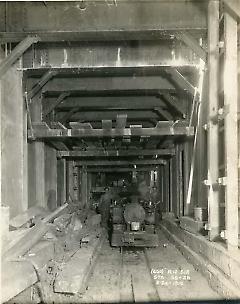 [Two workers in subway tunnel]