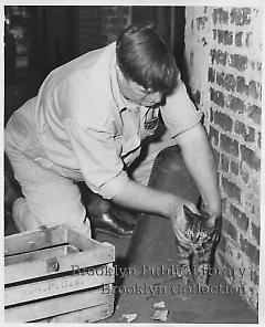 [John Malone and cat at A. S. P. C. A.]