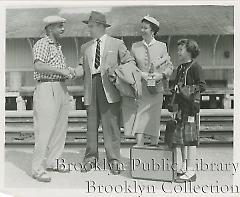 [Pee Wee Reese and family at train station]