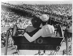 [Young woman and sailor on ferris wheel]