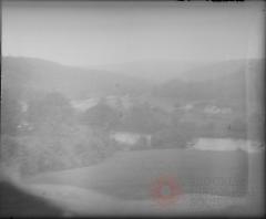 [Landscape view with hills, river, farmhouse and buildings]