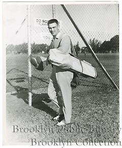 [Clem Labine with golf bag]