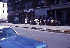 [Line outside of a liquor store]
