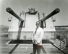[Man in white suit jacket and sunglasses at Brooklyn Navy Yard]