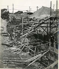 Showing trench and concrete work on cut at 4th Ave. looking north from spoil heap
