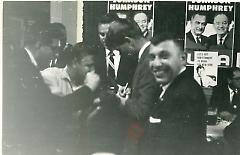 [Robert F. Kennedy signing autographs]