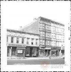 [At left is a vacant bar & grille restaurant for sale.]