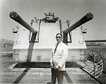 Man in white suit jacket and sunglasses at Brooklyn Navy Yard, 1965. Anthony Costanzo Brooklyn Navy Yard Collection