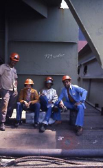 Seatrain workers and the supervisor, "Frenchie" on the deck, 1977. Frank J. Trezza Seatrain Shipbuilding Collection